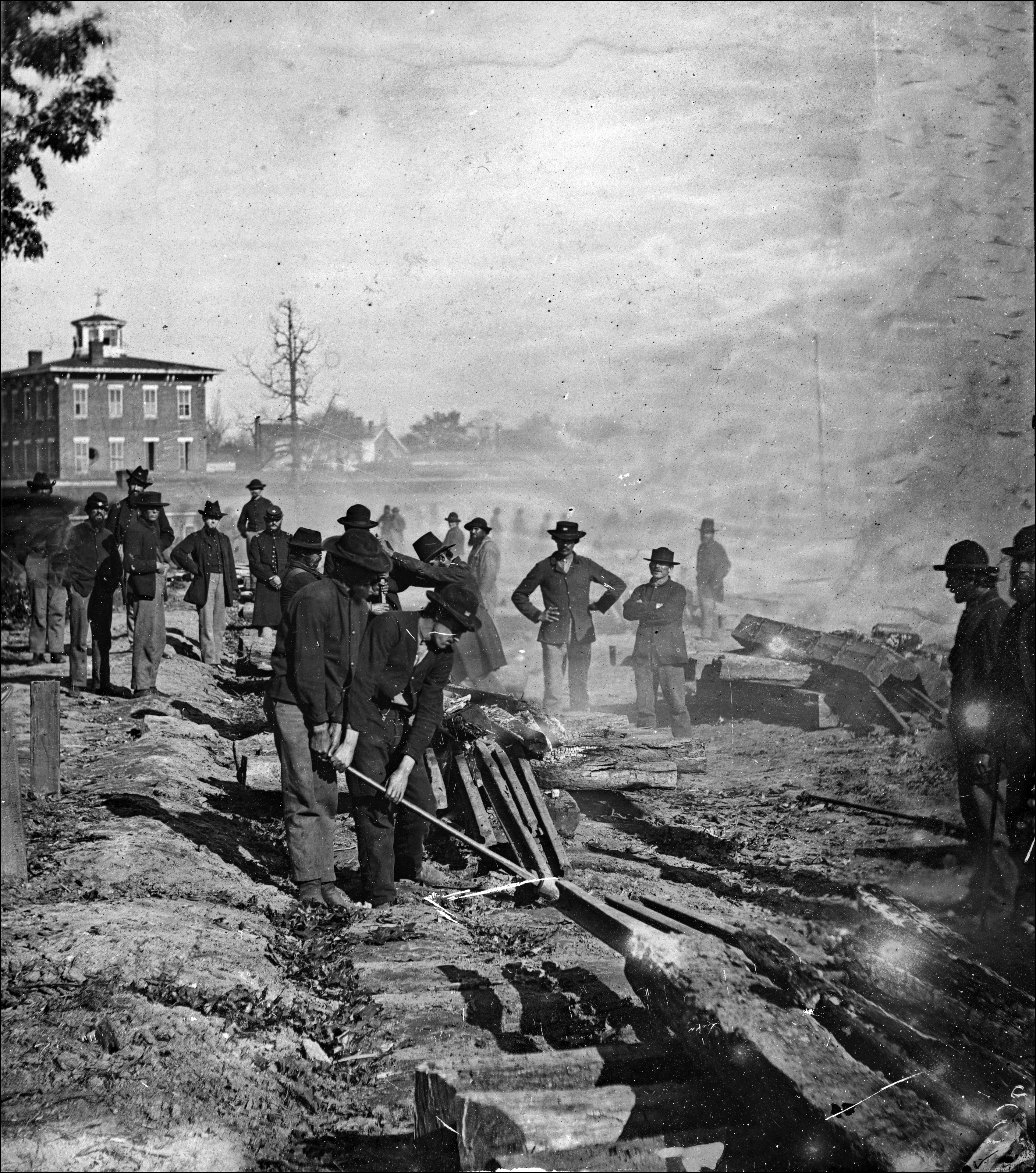 Shermans men pulling up rail ties